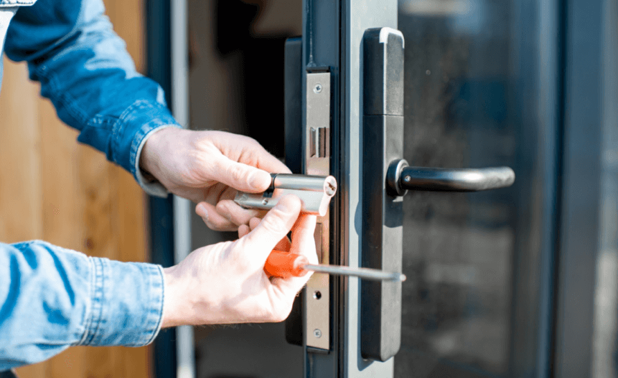 man fixing door locks