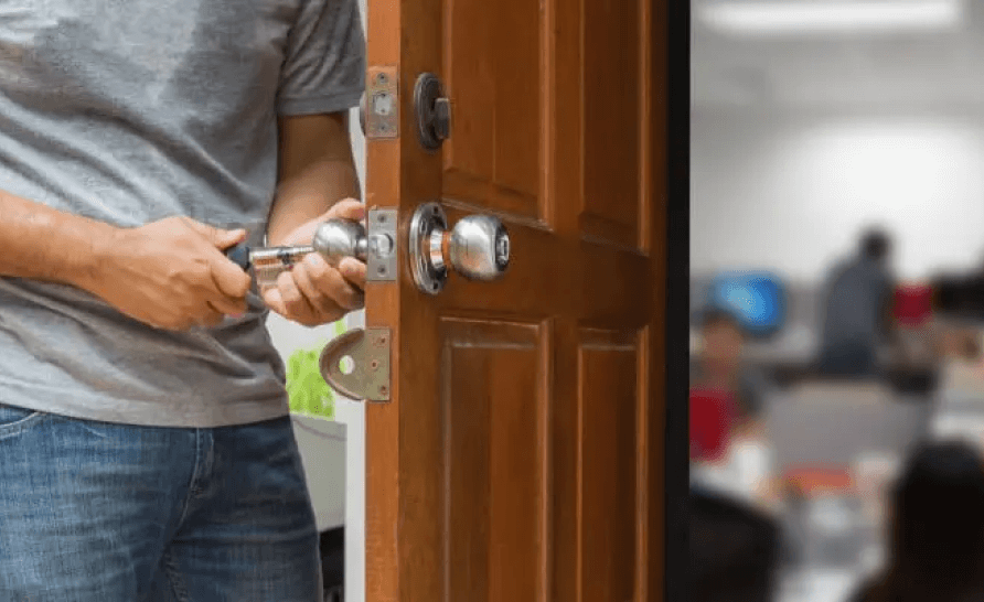 Man repairing residential door lock