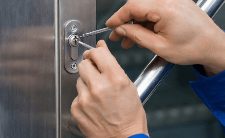 man fixing door lock