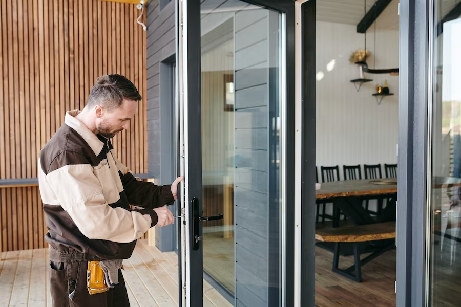 A locksmith in action, repairing a commercial door lock