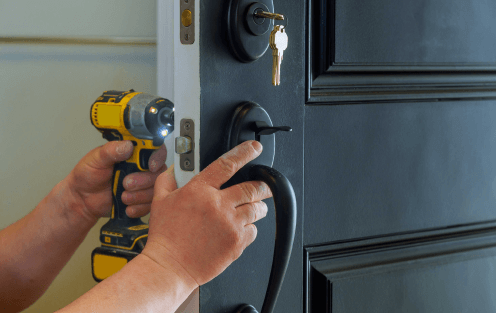 Men repairing door lock